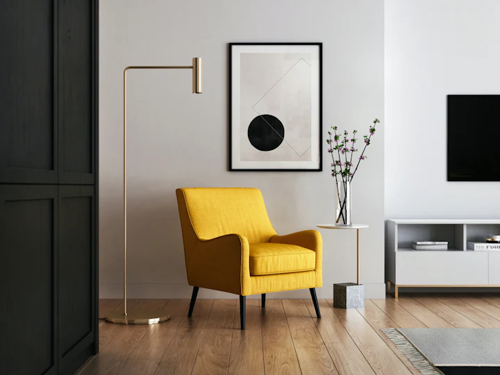 Living room with a mustard armchair and a floor lamp