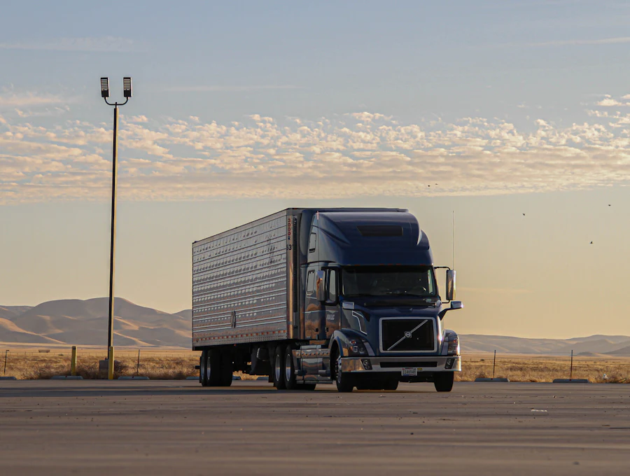 Lorry driving on a highway at sunset